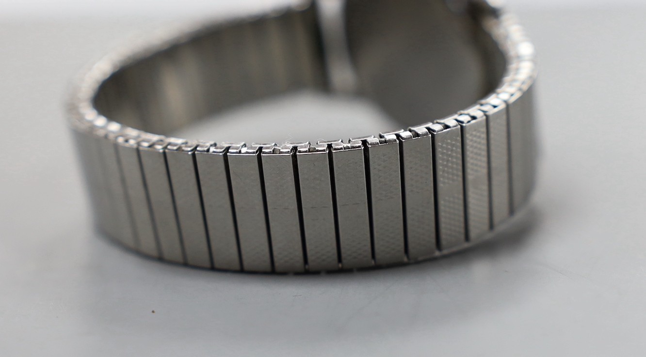 A gentleman's stainless steel Omega manual wind wrist watch, case diameter 29mm, with black Arabic dial and subsidiary seconds, on associated flexible strap.